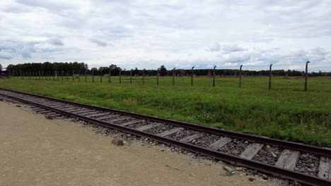 barbed wire fences and old train tracks in