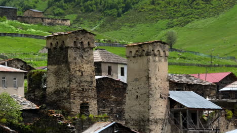 Ancient Stone Towers Over Ushguli Rural Village In Svaneti, Georgia. Aerial Close-up Shot