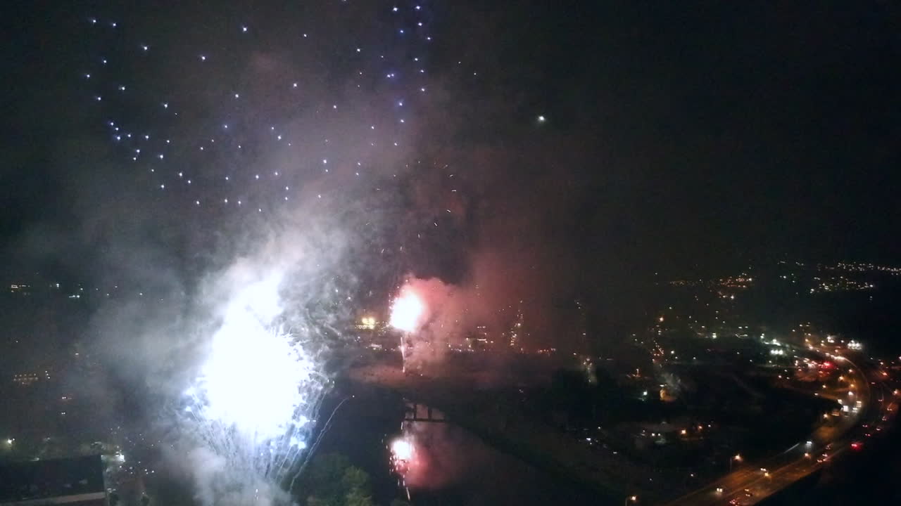 Drone footage of fireworks in reverse over a highway