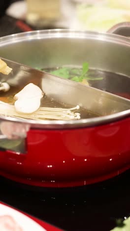 cooking and sharing hotpot with friends