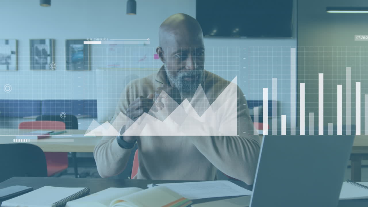 Animation of statistical data processing against portrait of african american man smiling at office