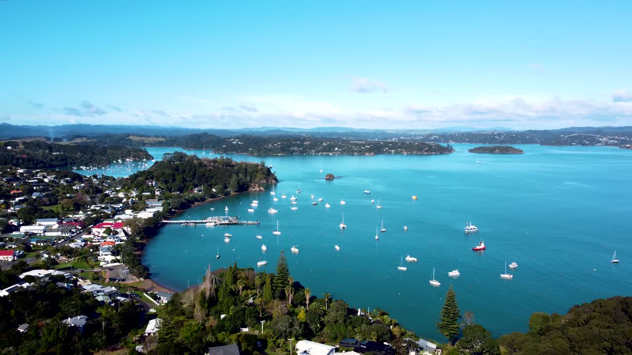 Drone view of a small town and sailboats on a sunny day in Russel, Bay of Islands, Northland, New Zealand.