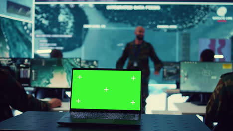 Greenscreen-running-on-a-laptop-in-military-base-command-center