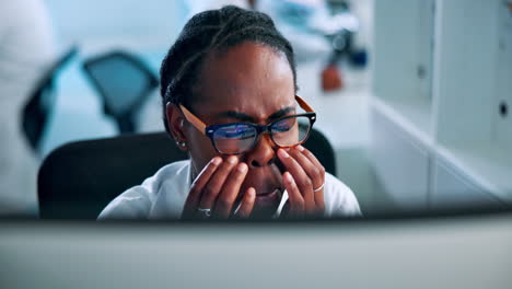 tired scientist working on computer