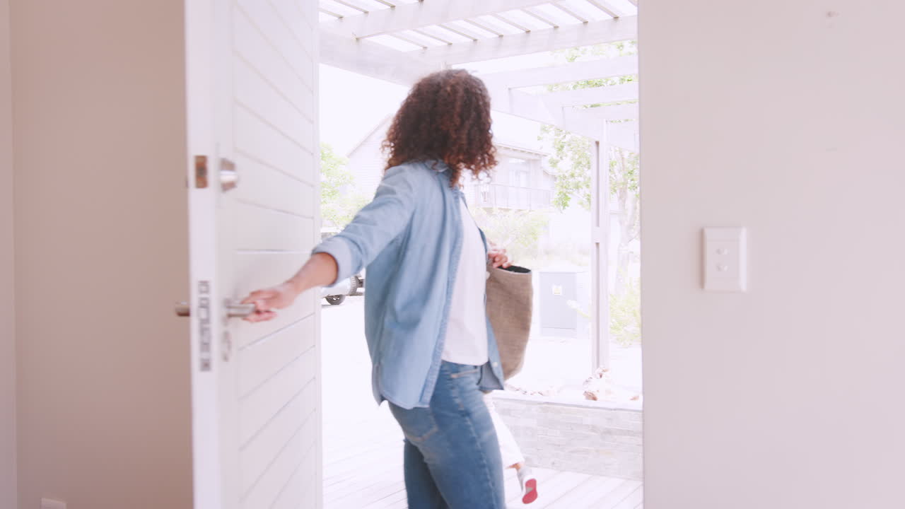 Mother Getting Children Ready To Leave House For School
