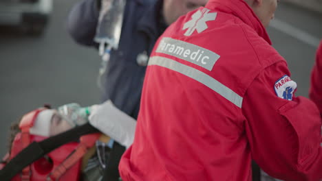 paramedic, team and man with first aid