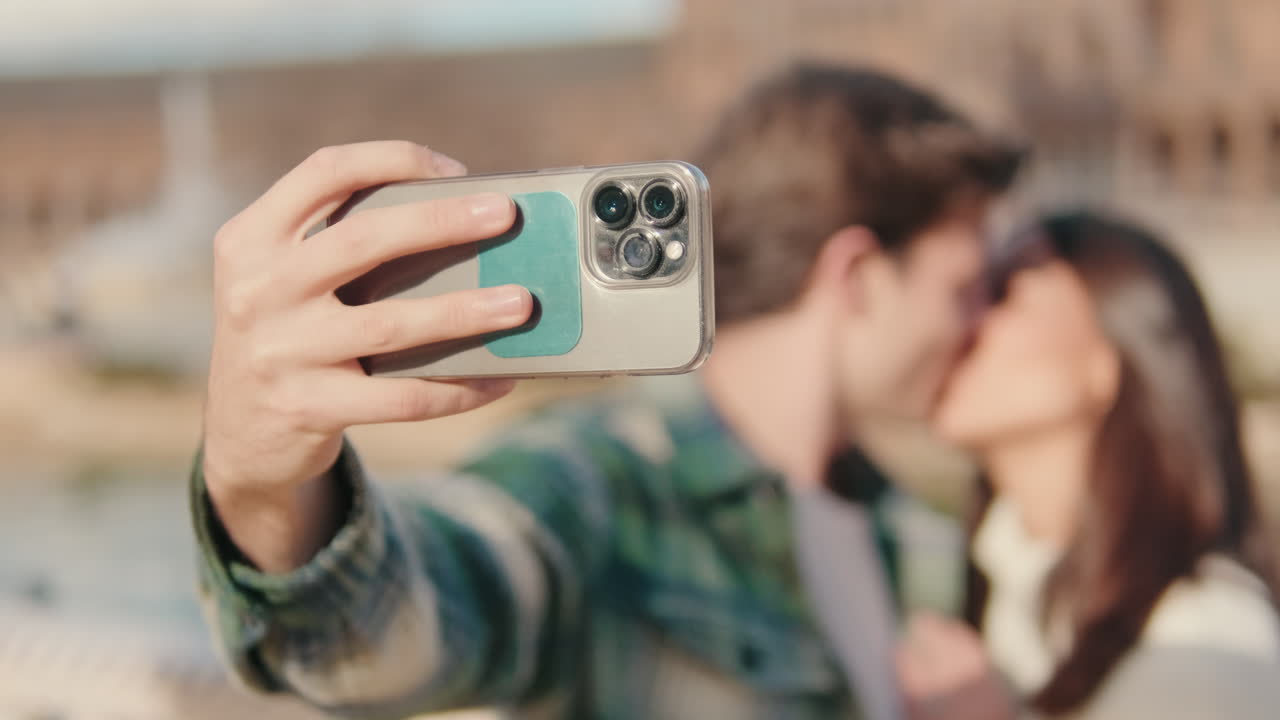 Close up, happy young lovers man and woman take selfie photo while standing on