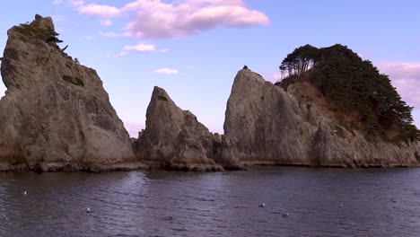 slow pan over beautiful ocean and rocks at jodagahama beach in japan