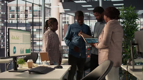 diverse team discussing data in a modern office