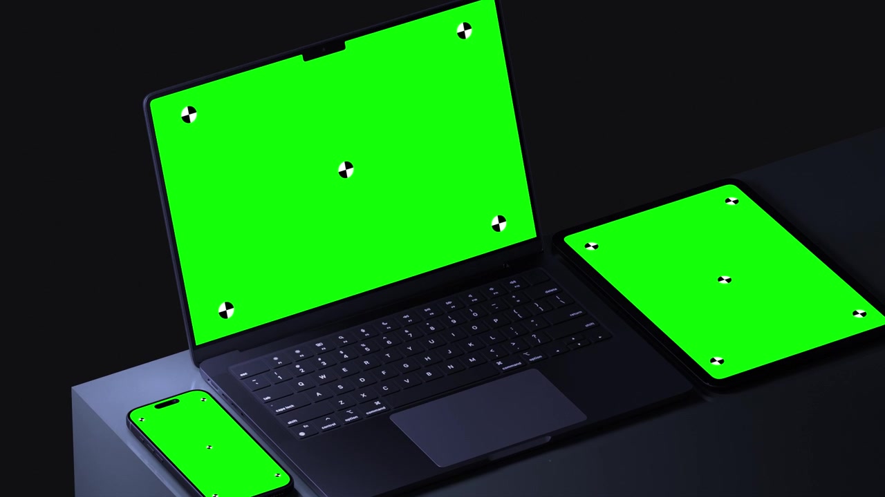 Laptop, tablet og smartphone med grønne skærme.