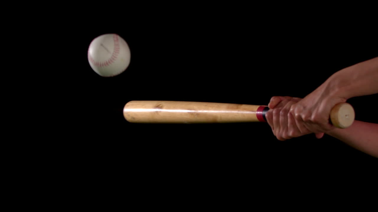 Baseball bat hitting the ball