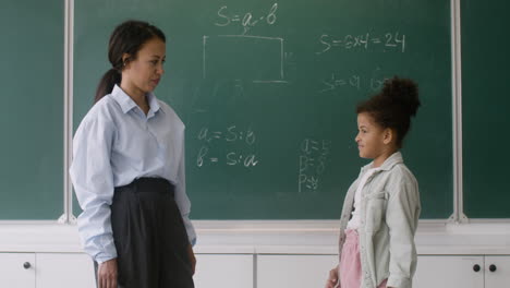 Teacher-and-pupil-at-the-blackboard.