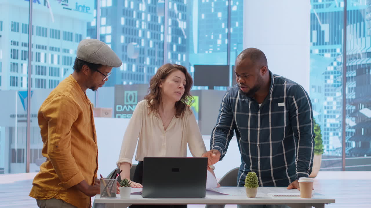 Real estate agent provides layout blueprints to clients in evaluating investment