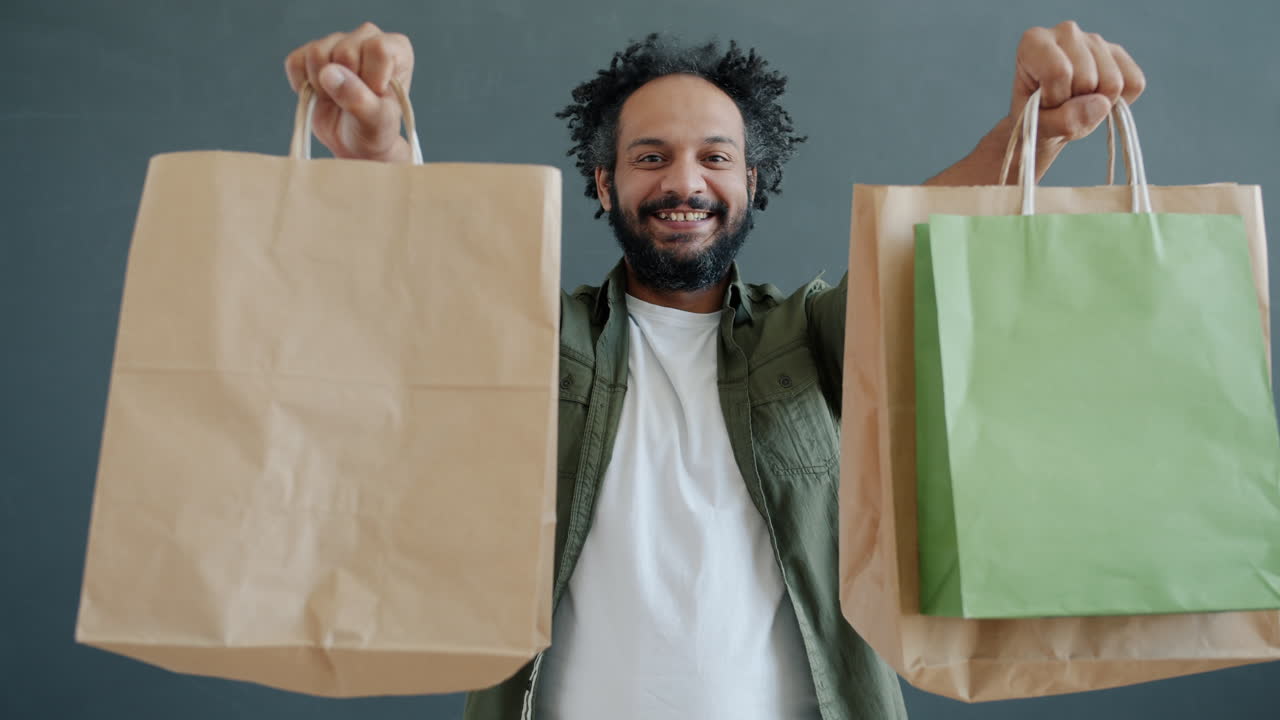 Man Holding Shopping Bags