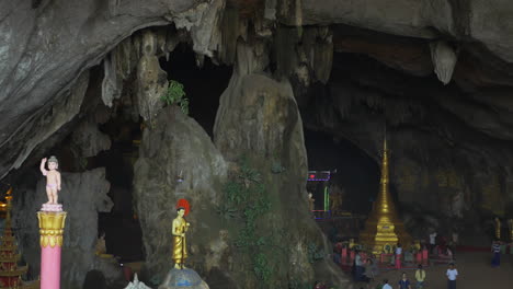 cave inside mountain statue temple monk buddhism