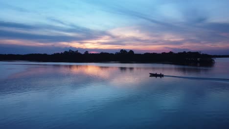 river-boat-sunset-beautiful-colorful-mirrored-drone