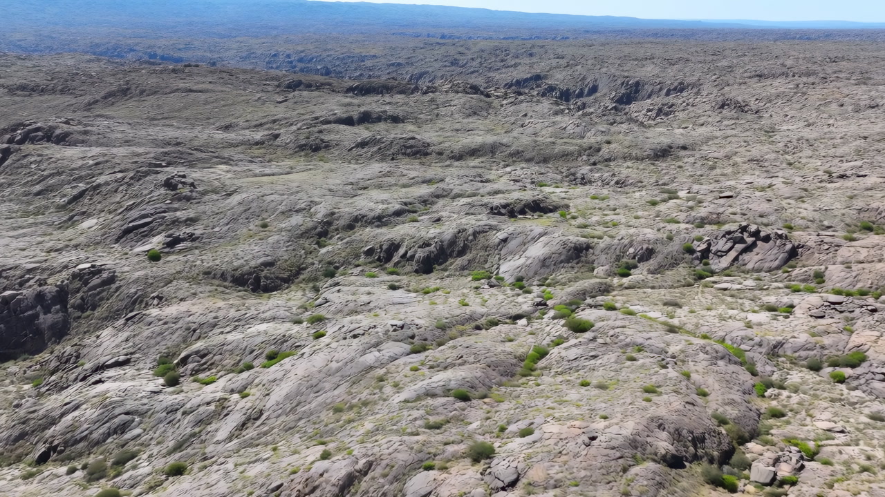 Drone Aerial Rocky Plateau Panorama Revealing Vast Rugged Expanse With Eroded Granite Outcrops And Sparse