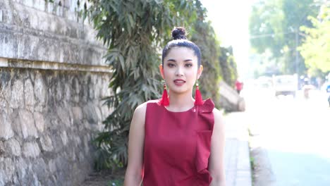 beautiful asian woman walking at footpath , slow motion