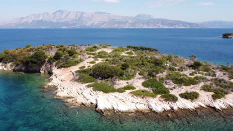 Pequeña-Isla-Desierta-En-El-Mar-Jónico-Cerca-De-Meganisi,-Lefkada,-Grecia---Antena