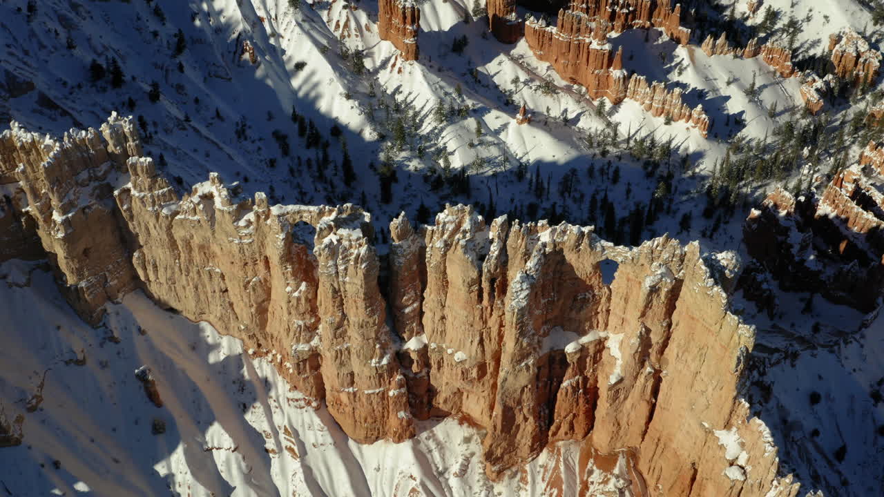 Winter Landscape of Snow-Covered Red Rock Formations in Bryce Canyon