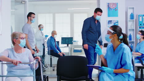 doctor in examination room listening senior patient lungs with stethoscope