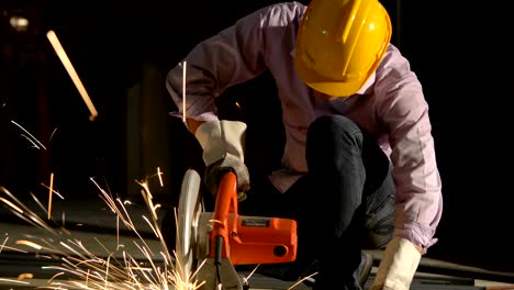 working with angle grinder, cutting pipe