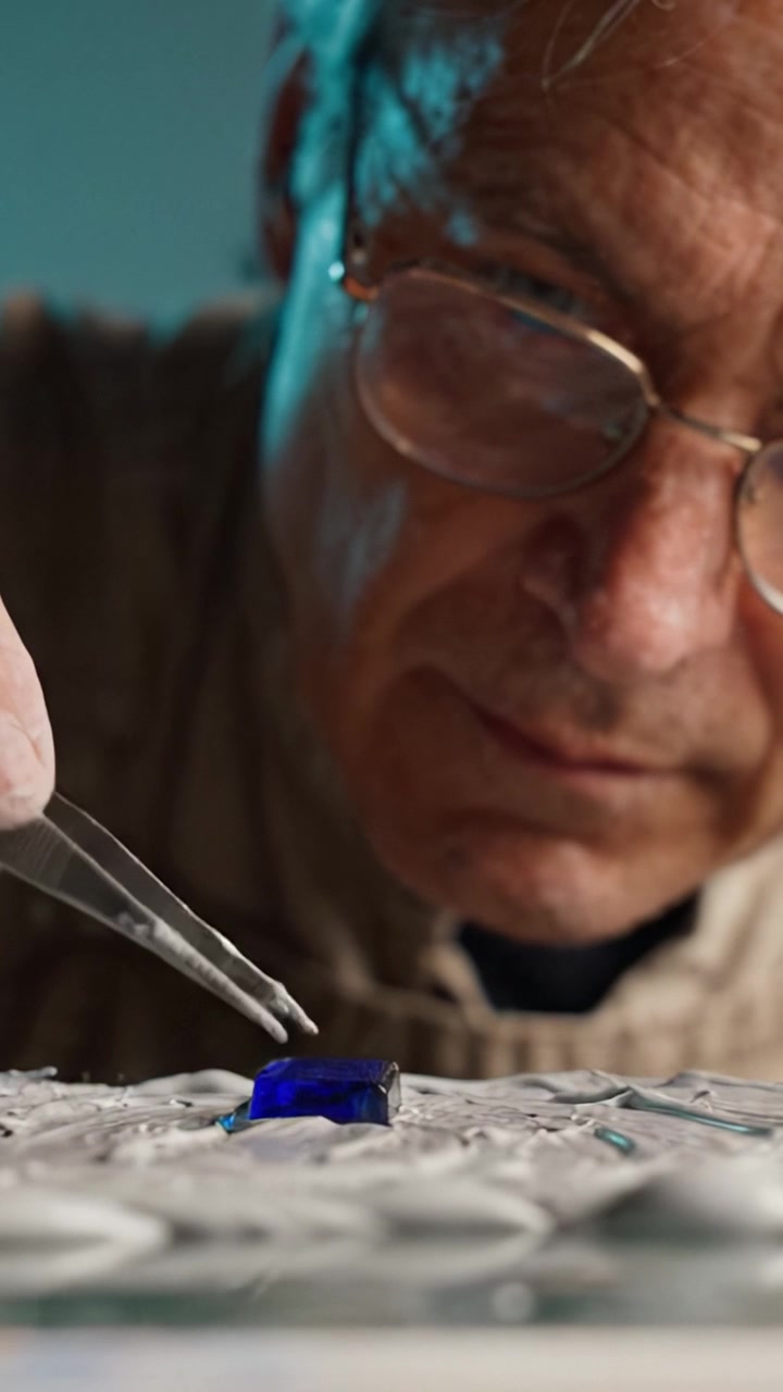 An Attentive Artisan Carefully Crafts a Beautiful Piece of Jewelry with Precision Tools and a Focused Expression, Highlighting the Craftsmanship Involved in Creation.