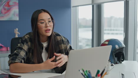 Worried-freelancer-videocalling-computer-office-closeup.-Sad-woman-talking-call