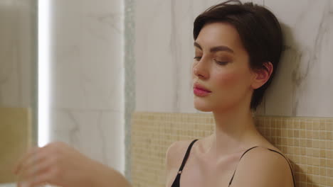 relaxed woman in spa bathroom
