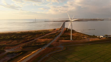 windturbines during sunset in the south west of the netherlands