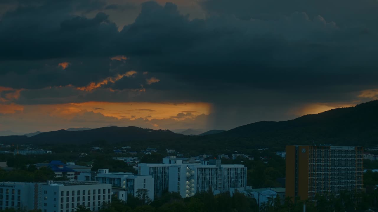 Dramatic Sunset Over City with Storm Clouds