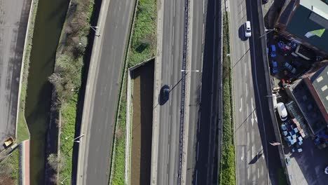 aerial footage of the a50, a500 motorway, dual carriage way in the heart of the city of stoke on trent in staffordshire, commuters travel north and south on the roads