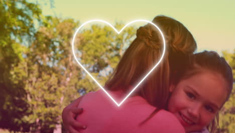 animación del corazón sobre madre caucásica feliz con su hija en el parque