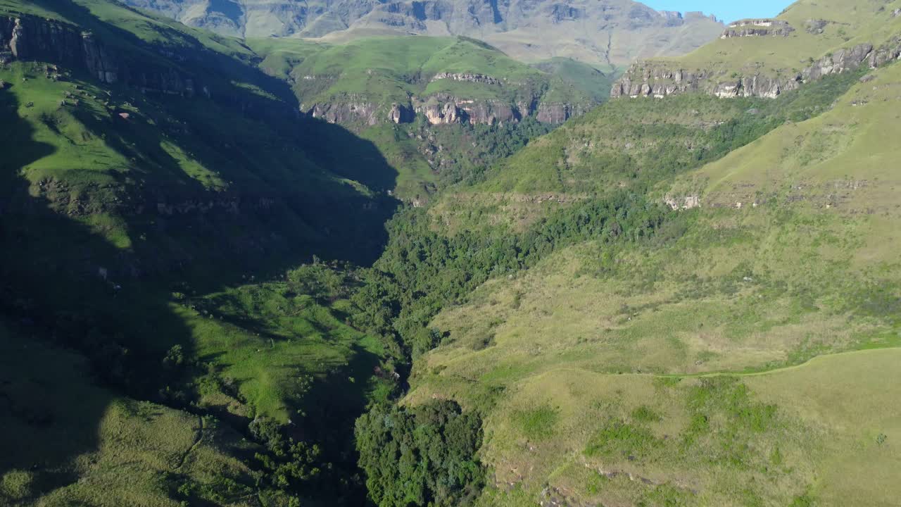 Scenic aerial view of the Drakensberg mountains with lush vegetation of summer, South Africa