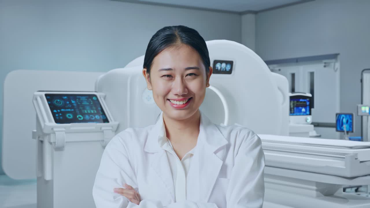 Close Up Of Asian Woman Doctor Crossing Her Arms And Smiling With Mri Machine In The Hospital