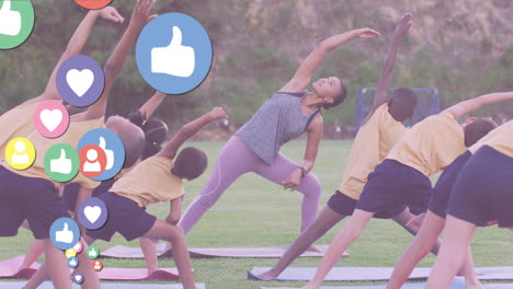 animation of media icons over diverse children with coach practicing yoga