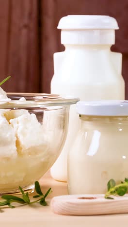 assorted dairy items arranged on a wooden surface
