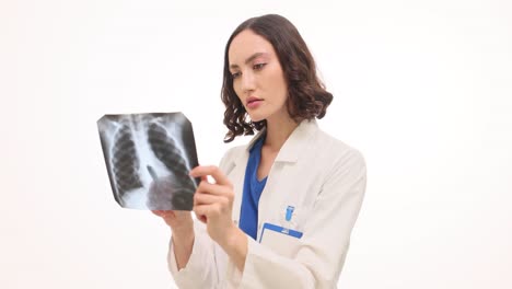 female doctor examining a chest x-ray