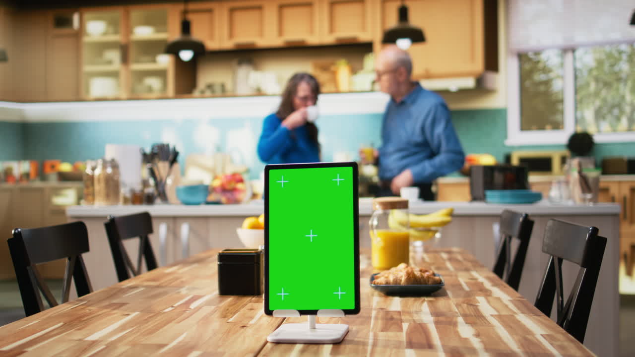 Vertical chroma key screen with old woman enjoying morning routine at home