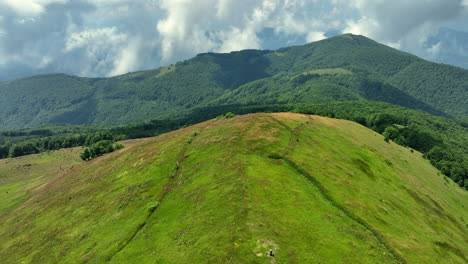 flight over green mountain peaks