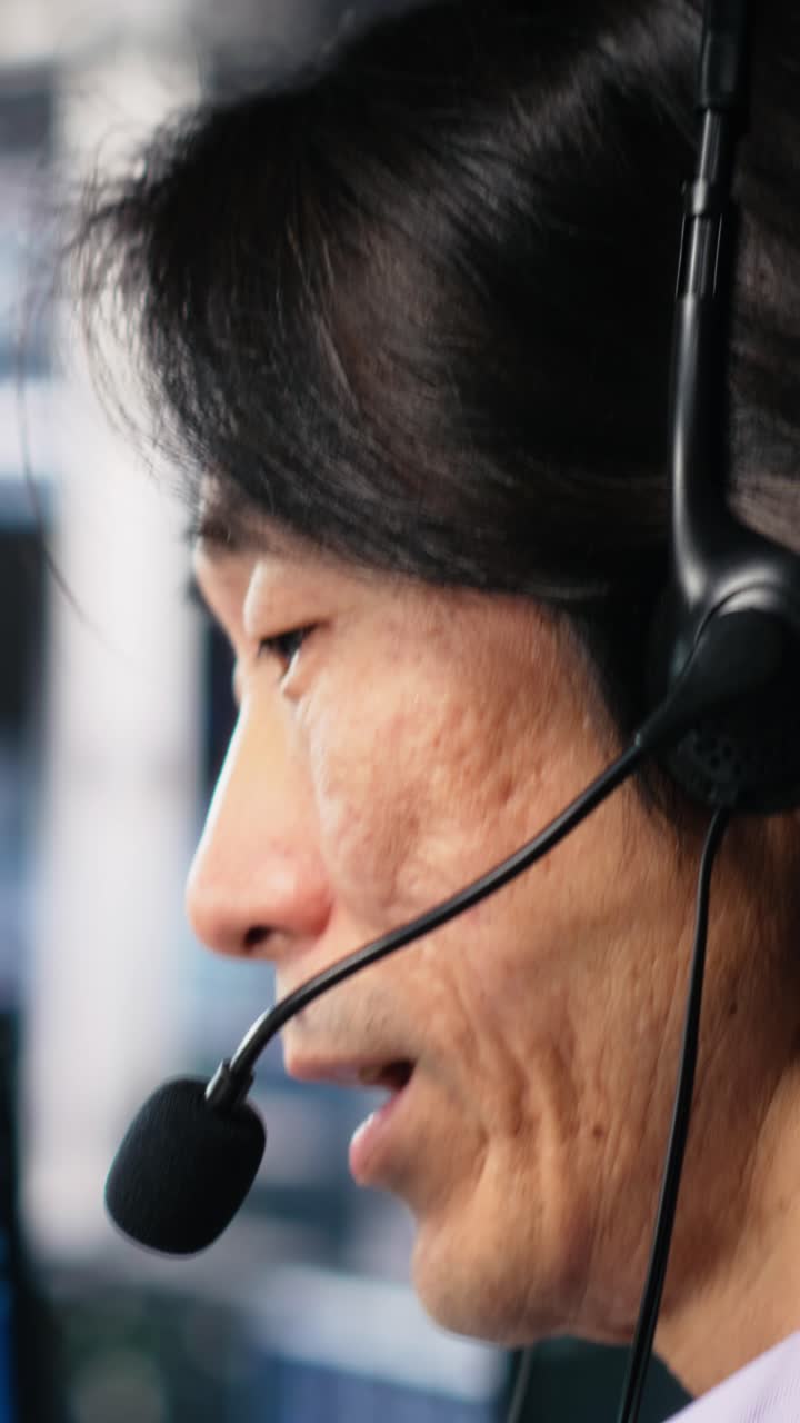 Vertical video Engineer in data center wearing headset assisting users with AI