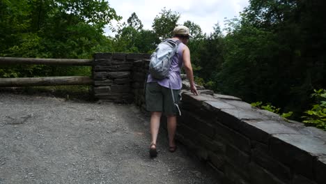 woman hikes on a manmade trail in new york state