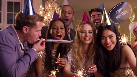 group of friends celebrating at new year party together