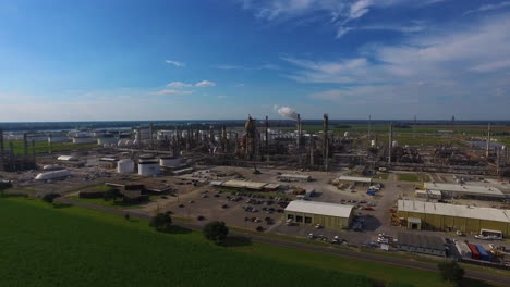 an aerial over an industrial oil refinery in an area of natural beauty 1