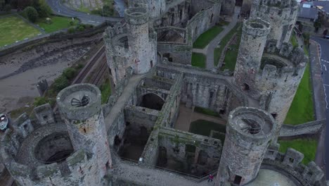 medieval conwy castle walled market town aerial view rising to birdseye