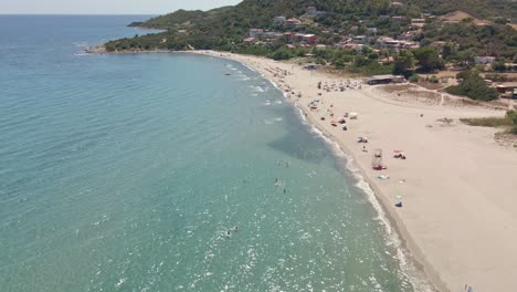 Aerial-Coastline-with-People-at-Beach