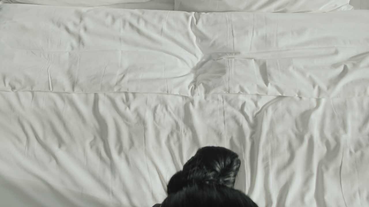 Housekeeper Resting on Bed after Work