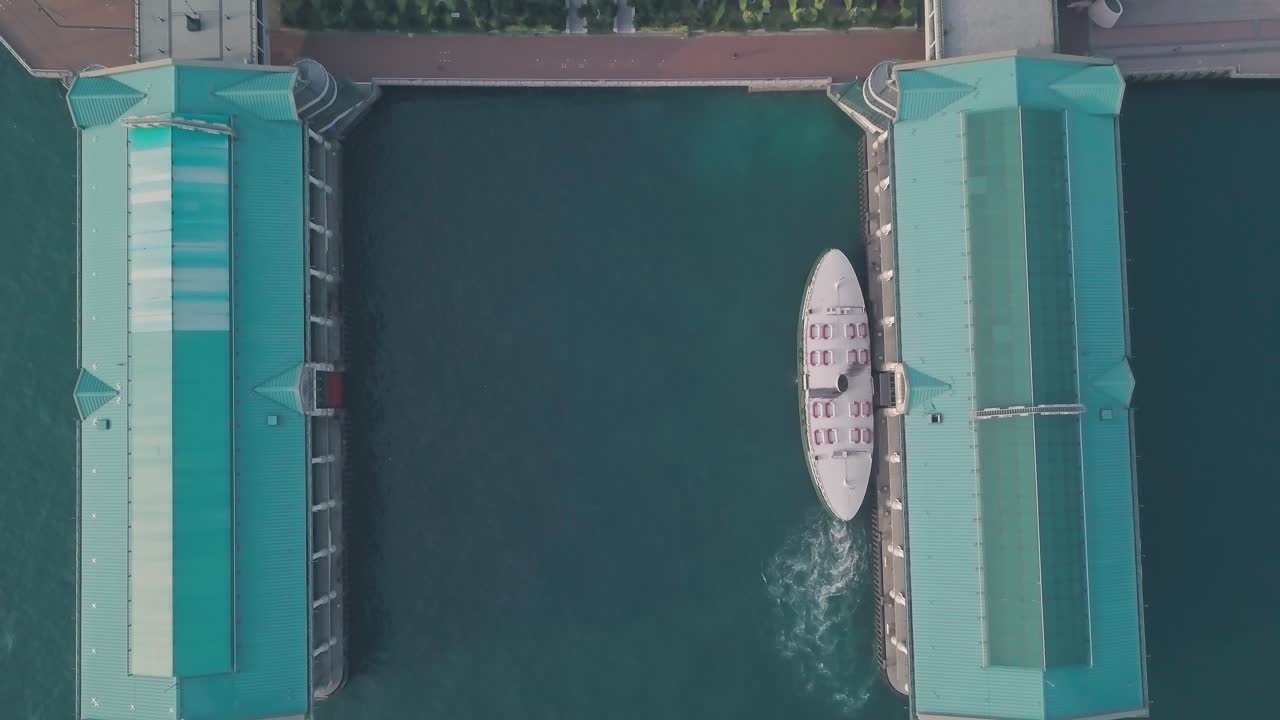 Hong Kong star ferry, central terminal and harbour front. Top down aerial drone view