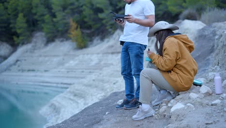 couple having a picnic by a quarry