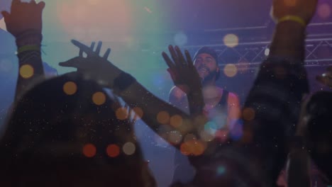 Animation-of-road-at-night-over-diverse-people-raising-hands-during-concert